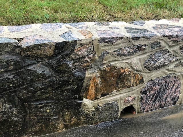 Pound Ridge, Scarsdale, Chappaqua, Bedford Hills, Before and After of stone wall pressure washed, black marks, oil, dirt, moss, mold, mildew, fungi, algae, soot, stains