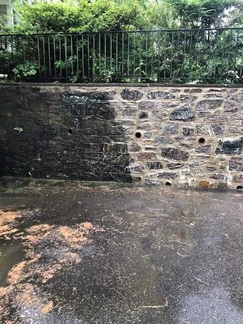 Rye roof cleaning, pressure washing, pound ridge, scarsdale, before and after of stone wall pressure washed, black marks, oil, dirt, moss, mold, mildew, fungi, algae, soot, stains
